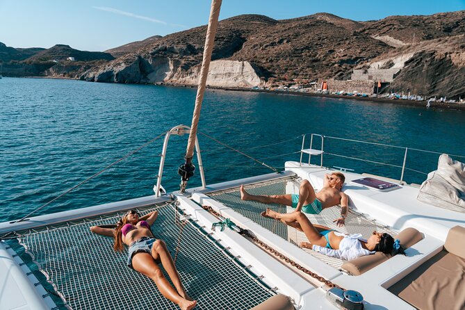 Santorini Sunset Sailing Cruise: Dinner, BBQ, Open Bar, Transfers - Sail Past White Beach, Indian Rocks, and the Venetian Lighthouse