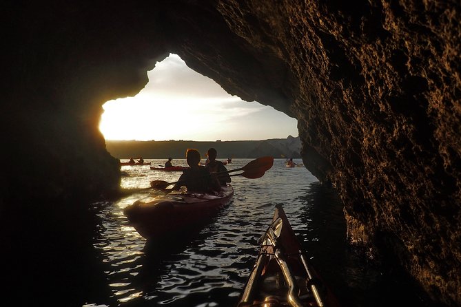 Santorini: Sunset Sea Kayak with Light Dinner with Pick-up Option - Red Beach by volcanic color: where the timing matters