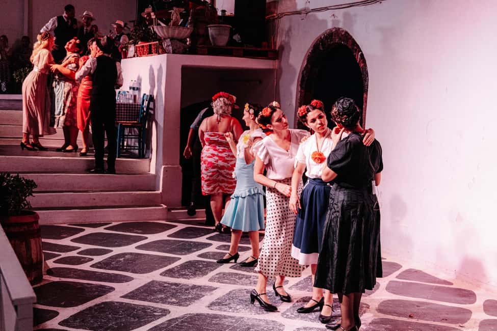 Santorini: The Greek Wedding Show Entry Tickets - The outdoor patio party: live music, tables, and the dance rhythm