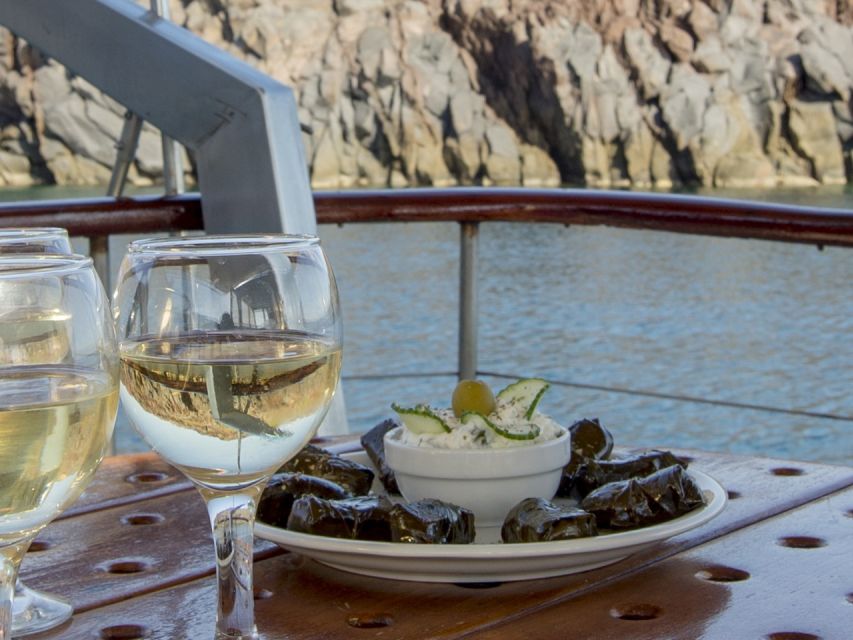 Santorini: Traditional Wooden Boat Tour with Meal and Wine - Caldera cruising from Vlychada: why the wooden-boat vibe works