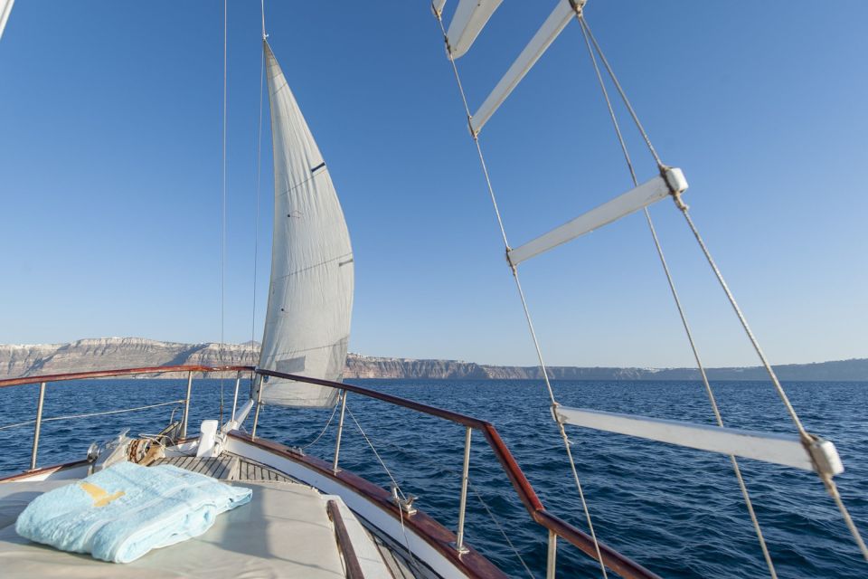 Santorini: Traditional Wooden Boat Tour with Meal and Wine - Thirassia Island: fishermen vibes and a quieter sea break