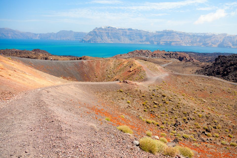 Santorini: Volcano and Hot Springs Sunset Dinner Cruise - Guides and the Boat Vibe: The Human Part of the Experience