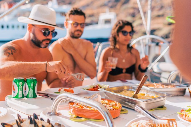 Sunset Caldera Sailing Cruise - Greek lunch and unlimited drinks: when the cruise turns social